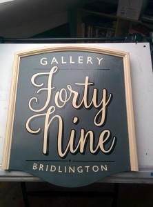 On the drawing board - the completed hand painted sign for Gallery 49, Bridlington